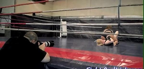  Muscular women wrestling in a boxing ring